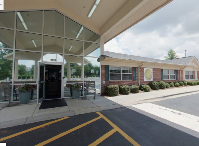 Building with glass entrance and brick facade