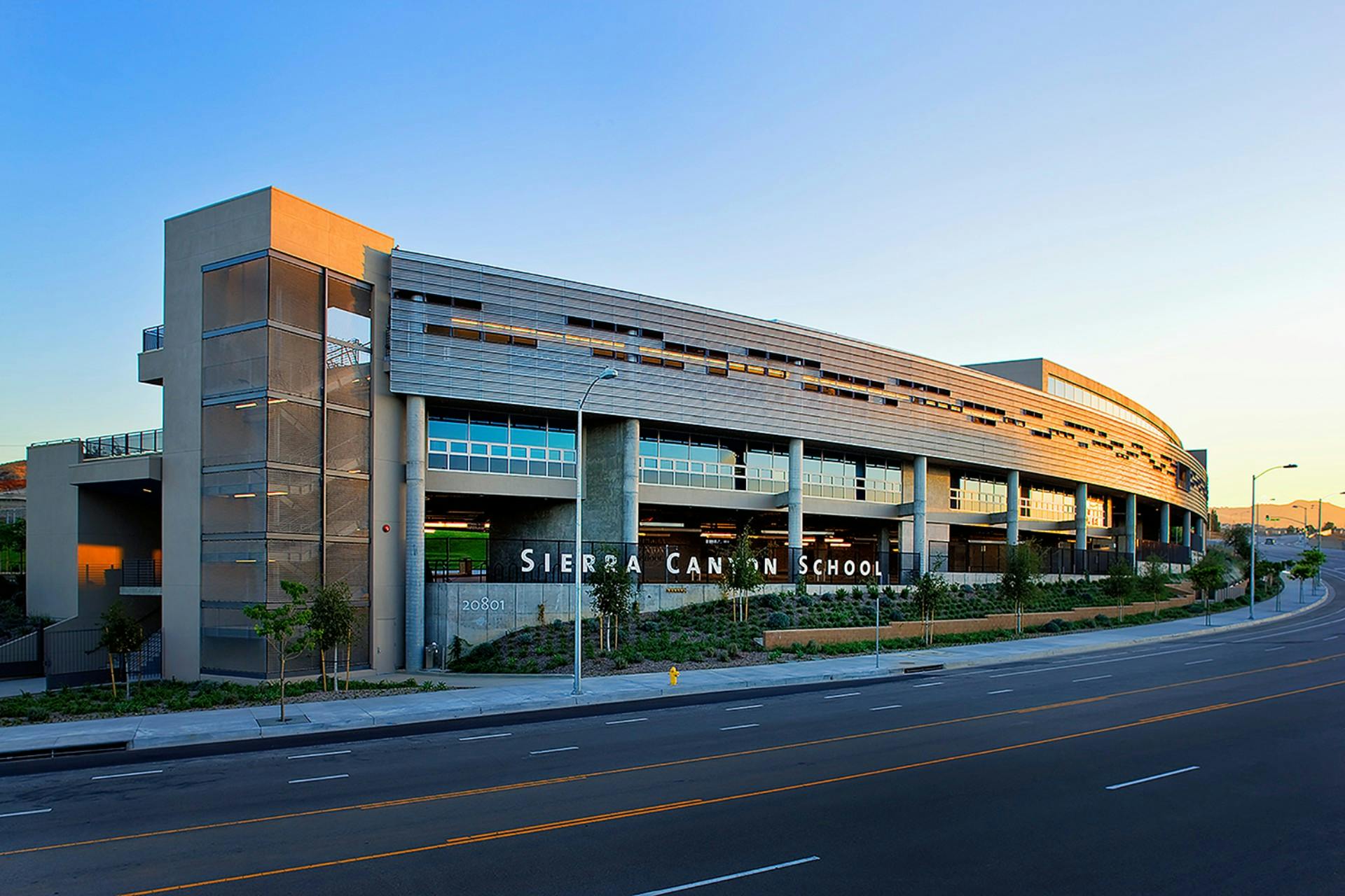 Exterior of Sierra Canyon School building with a road in front