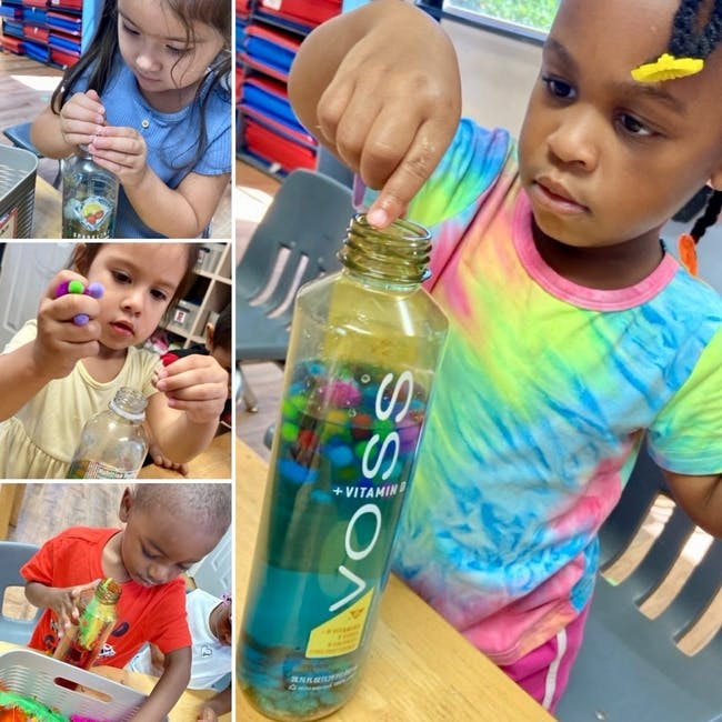 Child playing with a bottle filled with colorful beads
