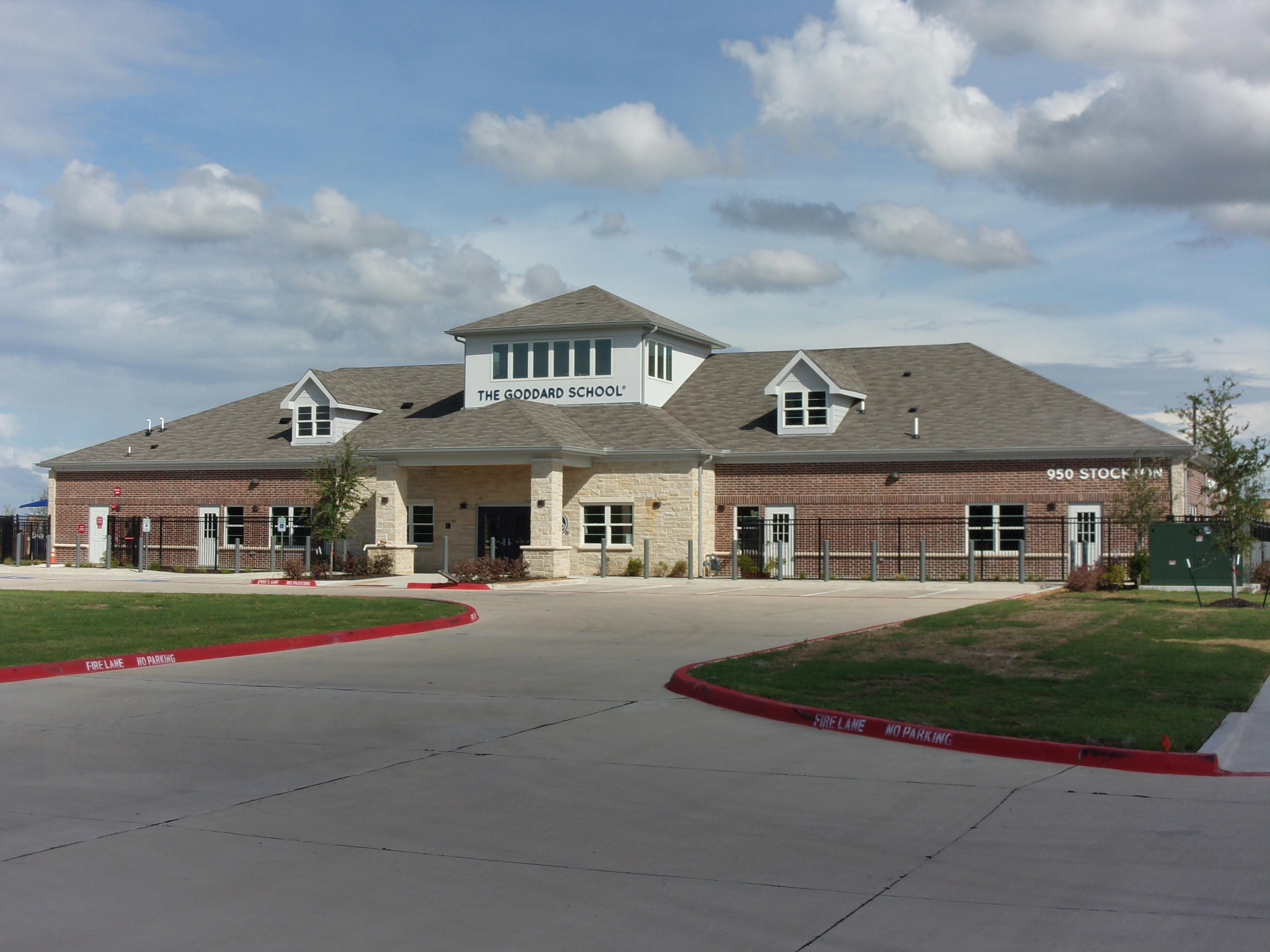 Exterior of a large building with a circular driveway