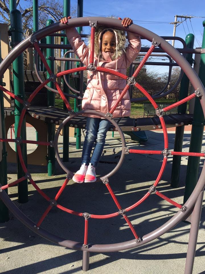 Child on a playground climbing structure