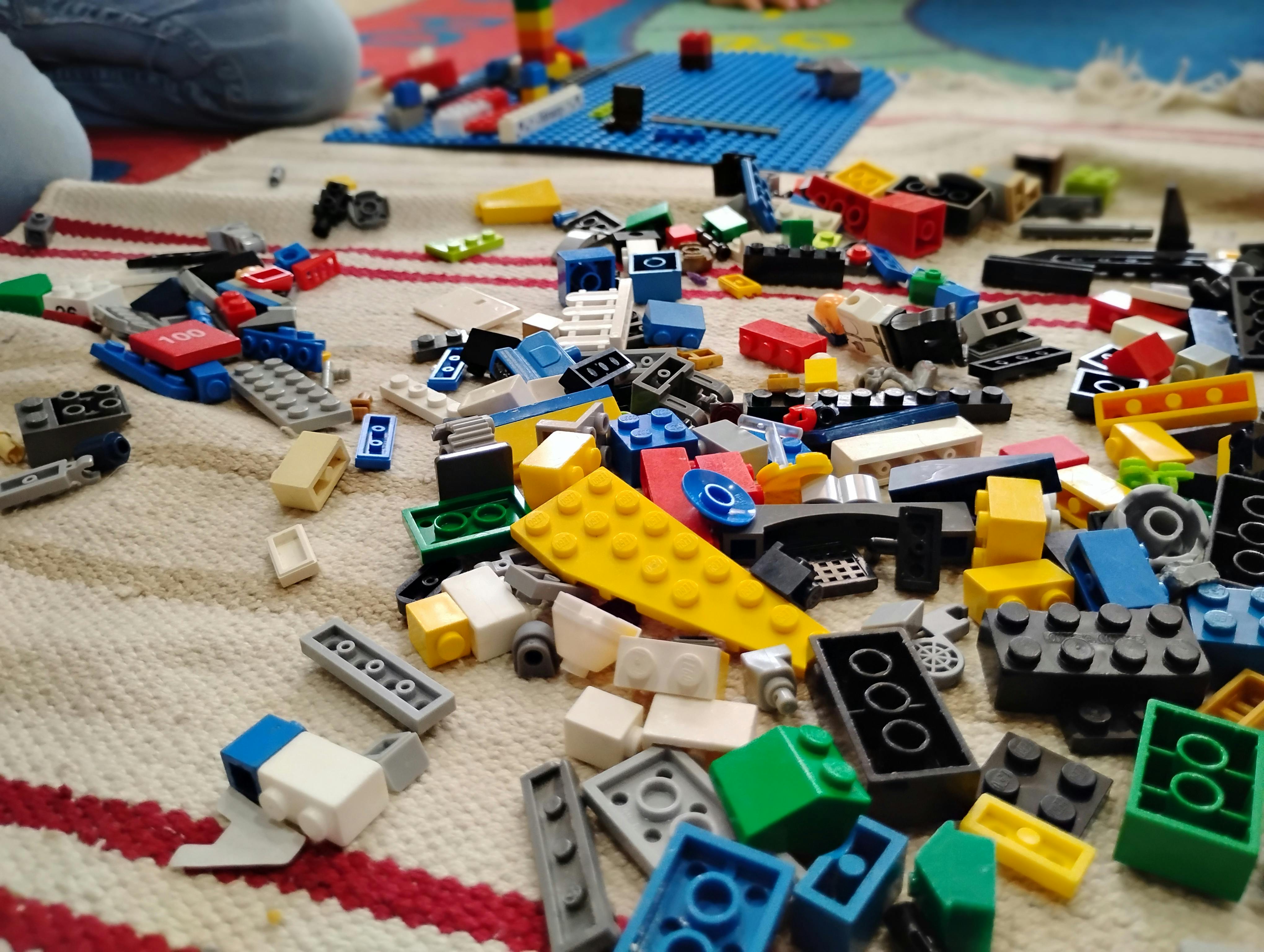 Assortment of building blocks scattered on a blanket