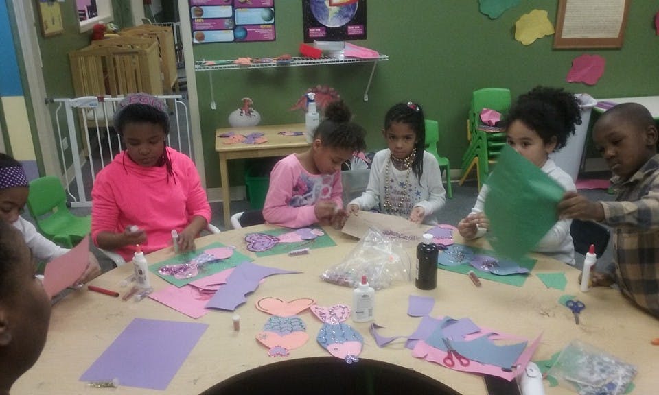 Children doing crafts at a table