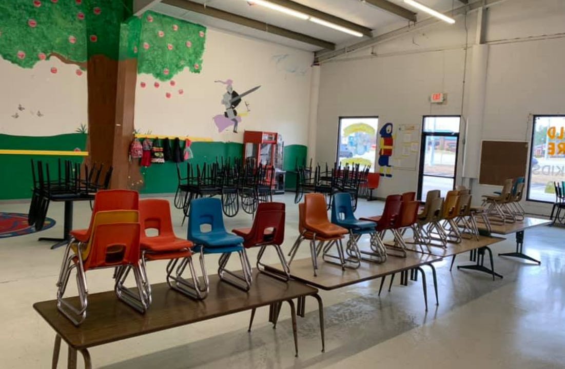 Empty classroom with colorful chairs and tables