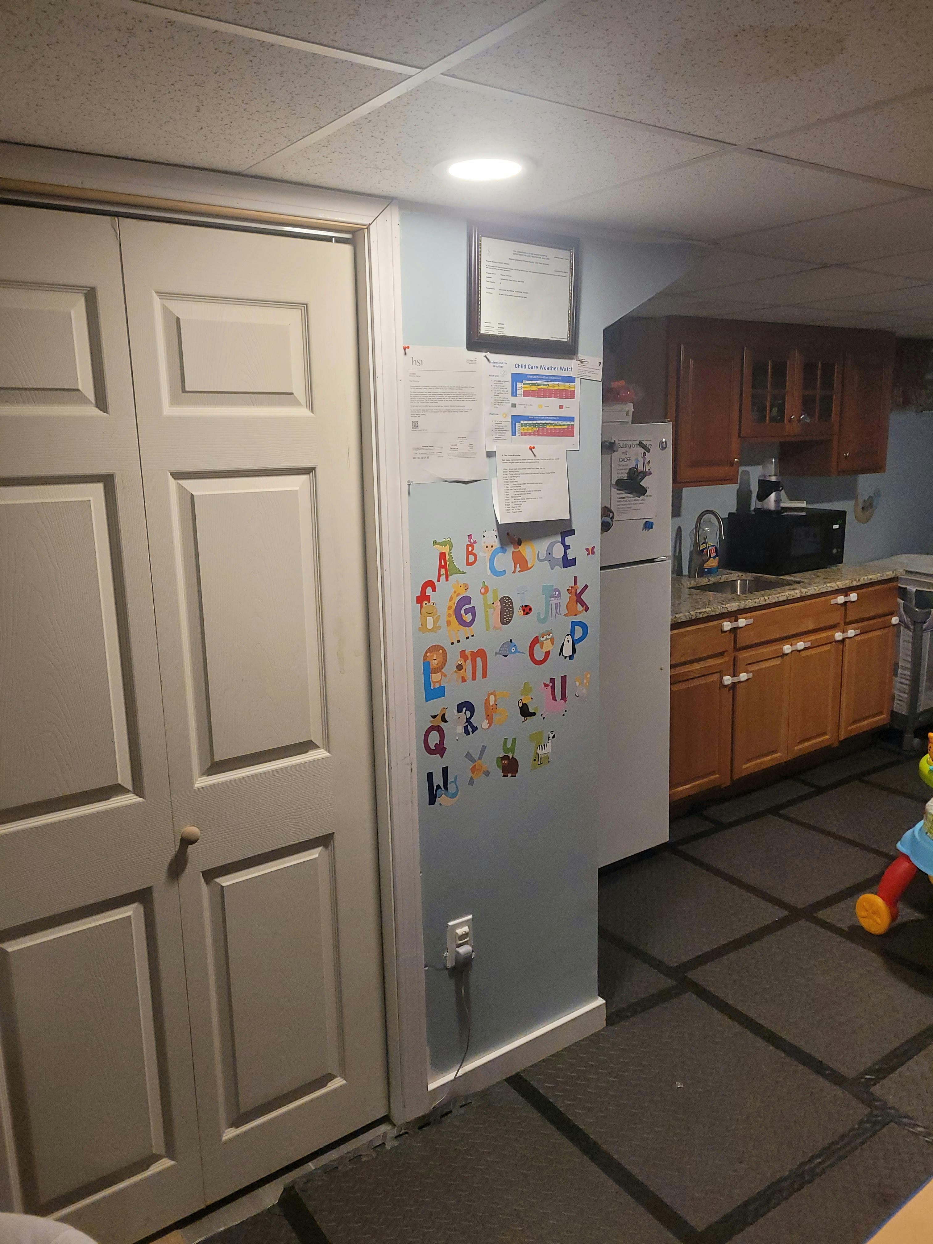 Kitchen area with alphabet magnets on a wall