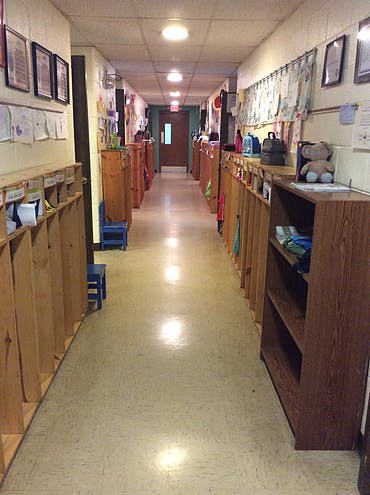 Long hallway with cubbies and shelves on both sides