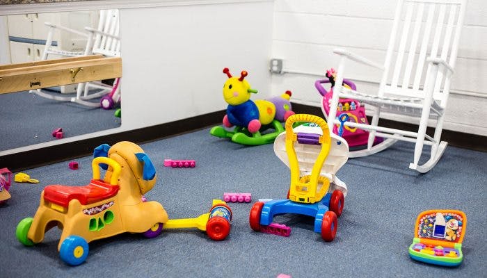 Children's toys on a carpeted floor