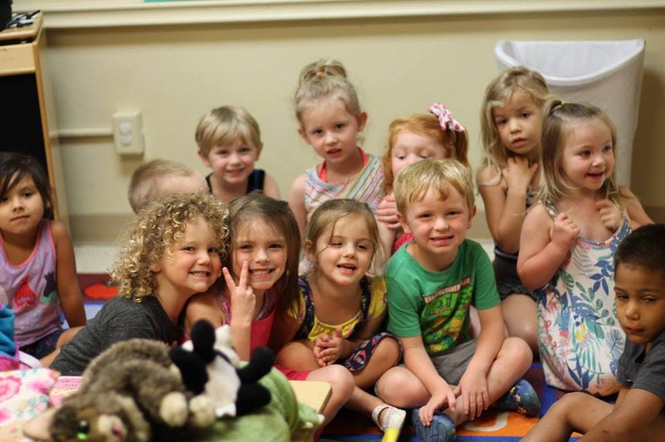 Group of children sitting on the floor