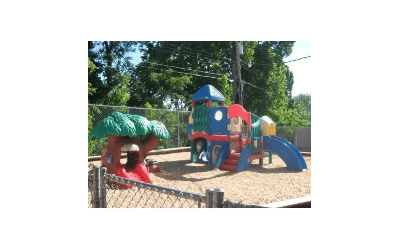 Playground with treehouse and colorful play structure