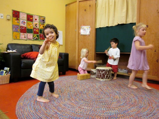 Four children playing in a room