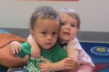 Two children embracing