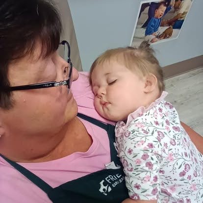 Person holding a sleeping child