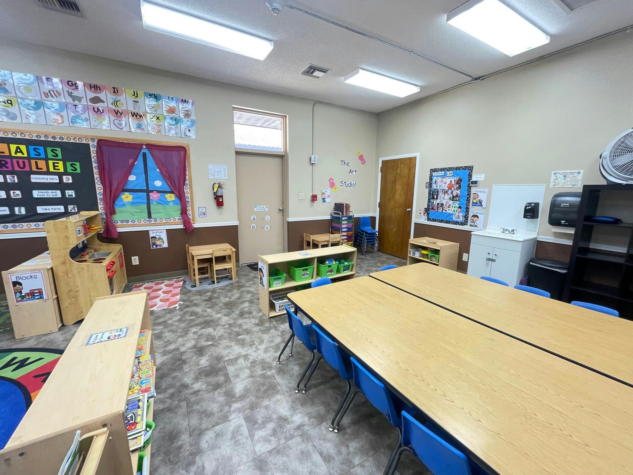 Classroom with tables, chairs, and learning materials