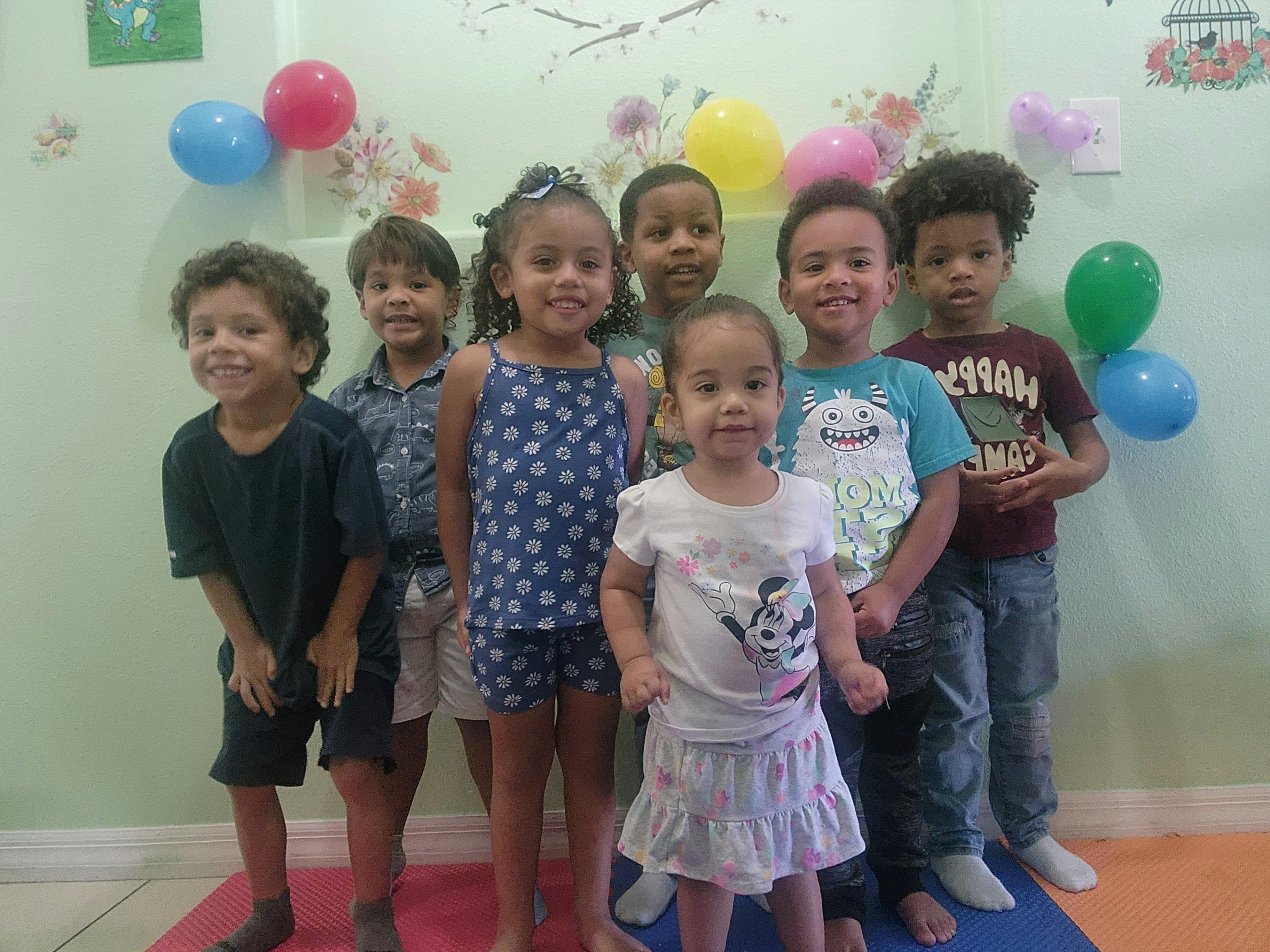 Group of children standing together indoors