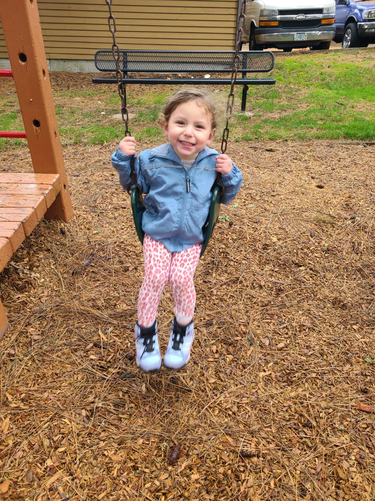 Child on a swing at a playground