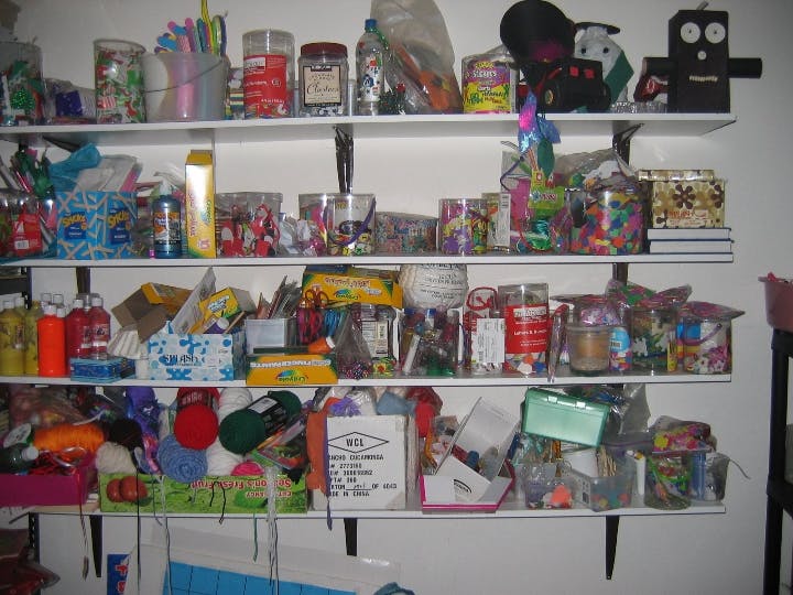 Shelves filled with various craft supplies and containers