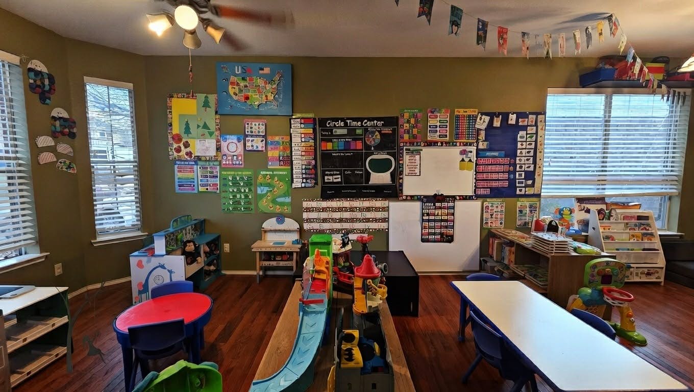 Children's classroom with colorful decorations, play areas, and educational charts