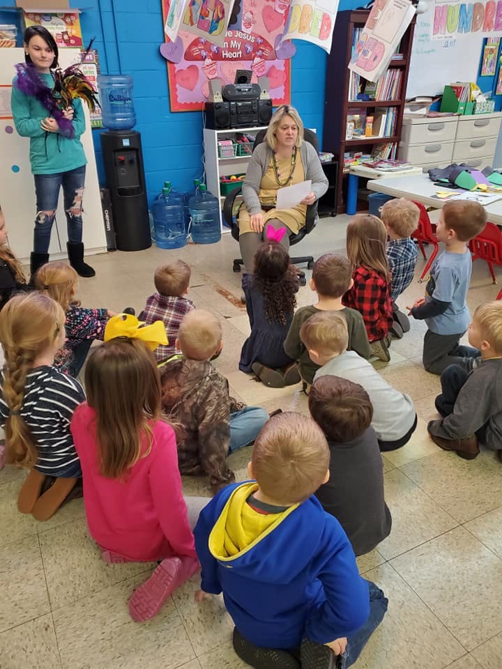 Adults and children in a classroom