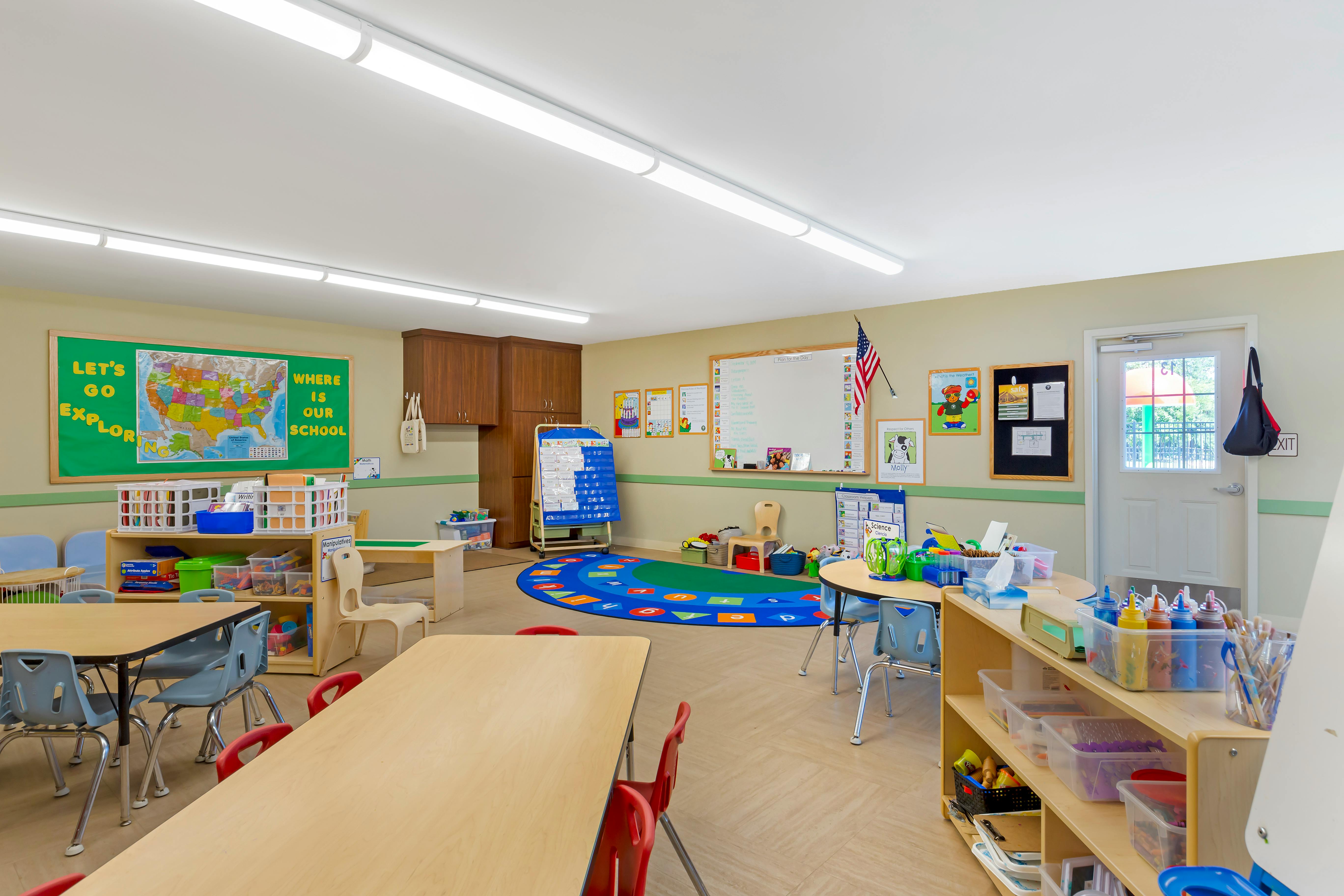 Classroom with tables, chairs, and learning materials