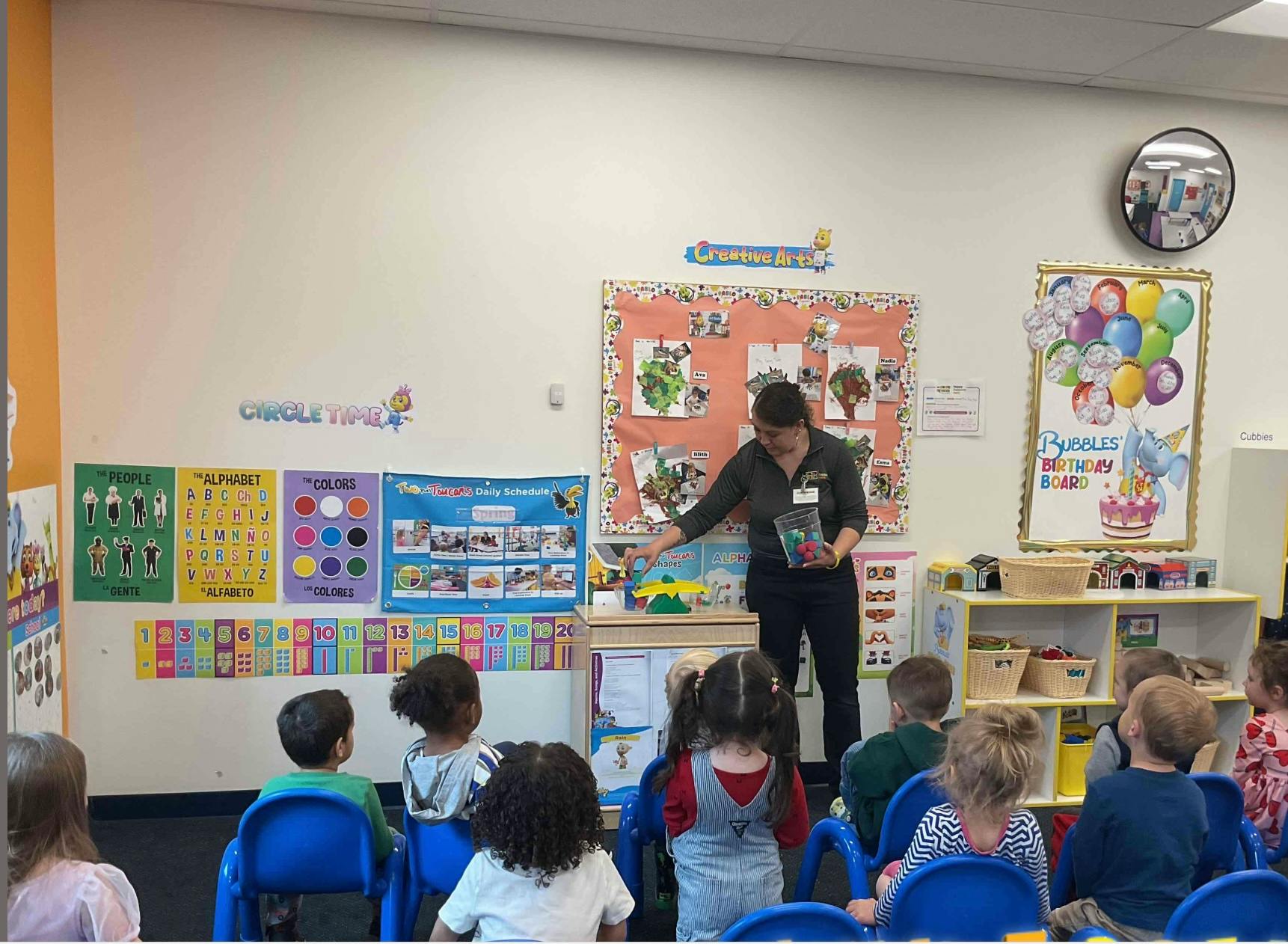 Person reading to children in a classroom