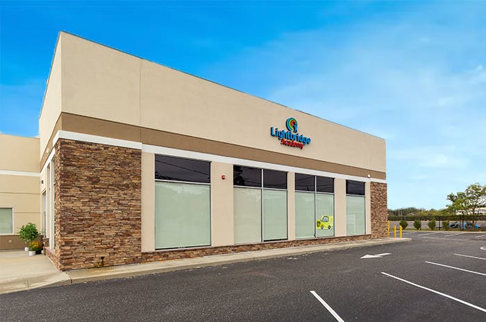 Exterior of a commercial building with a parking lot