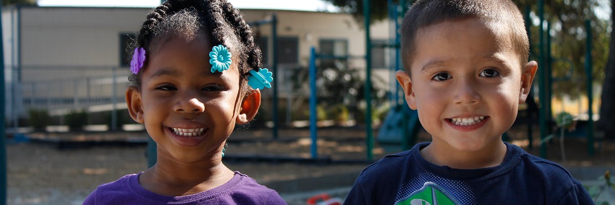 Two children smiling
