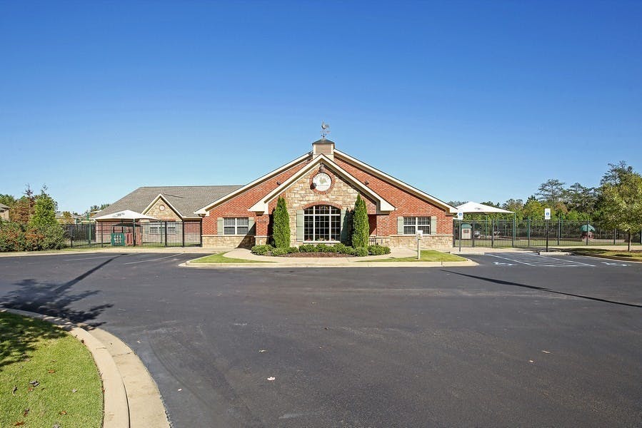 Brick building with stone facade and large window