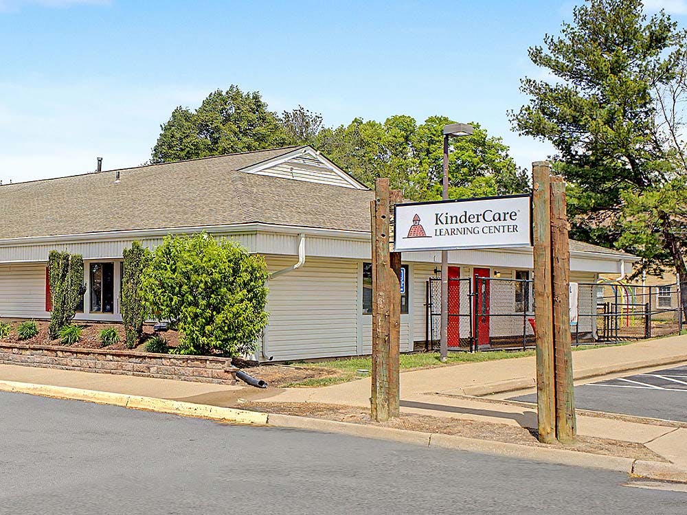 KinderCare Learning Center building exterior and sign from across a street