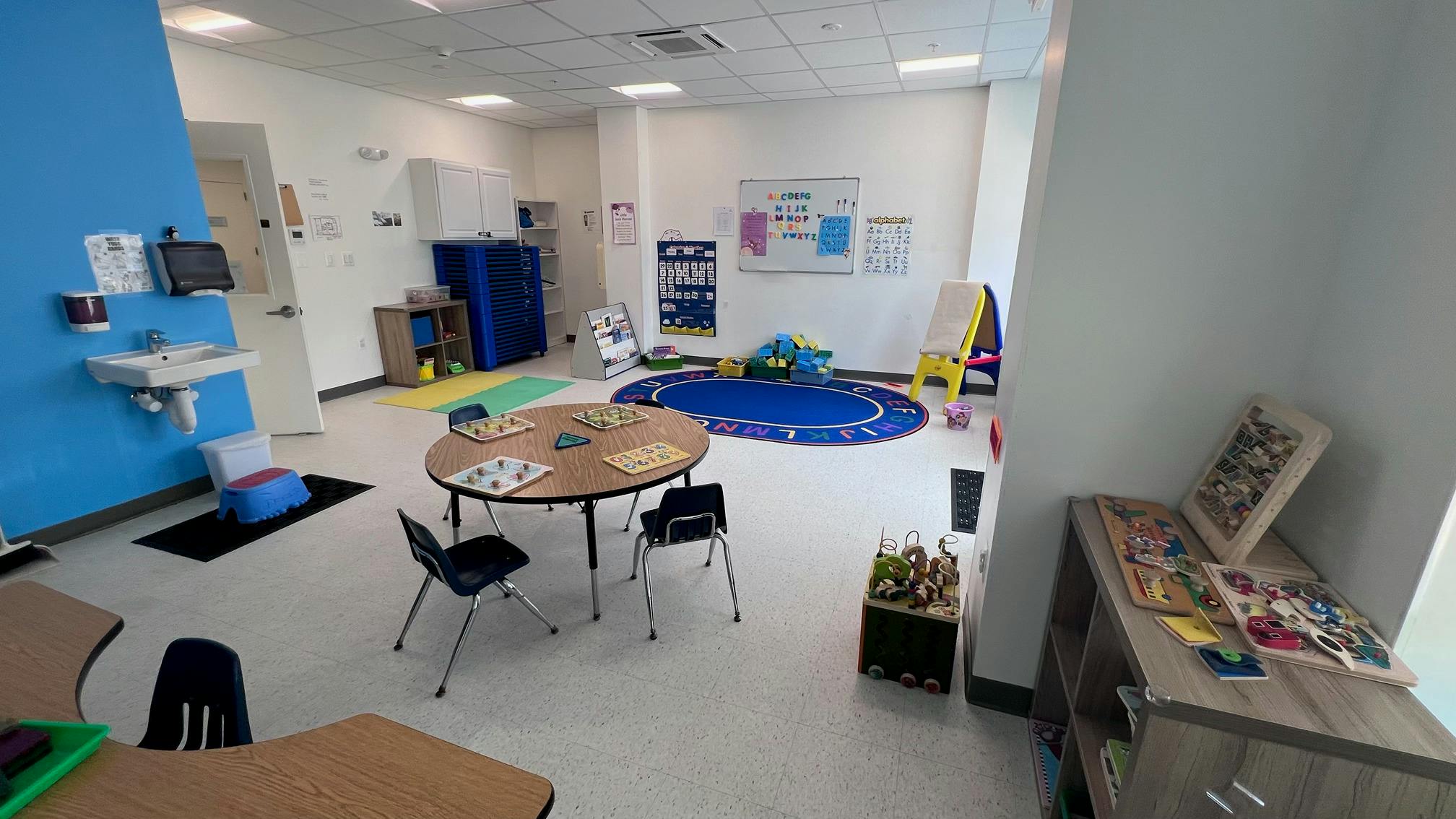 Classroom interior with small tables and chairs for children