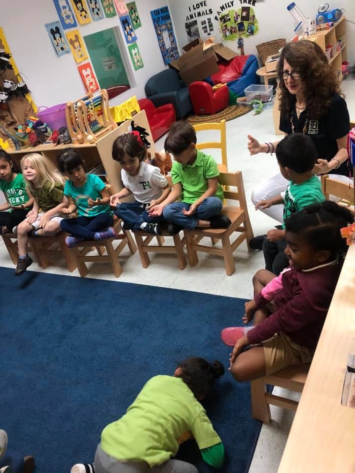 Adult and children in a classroom