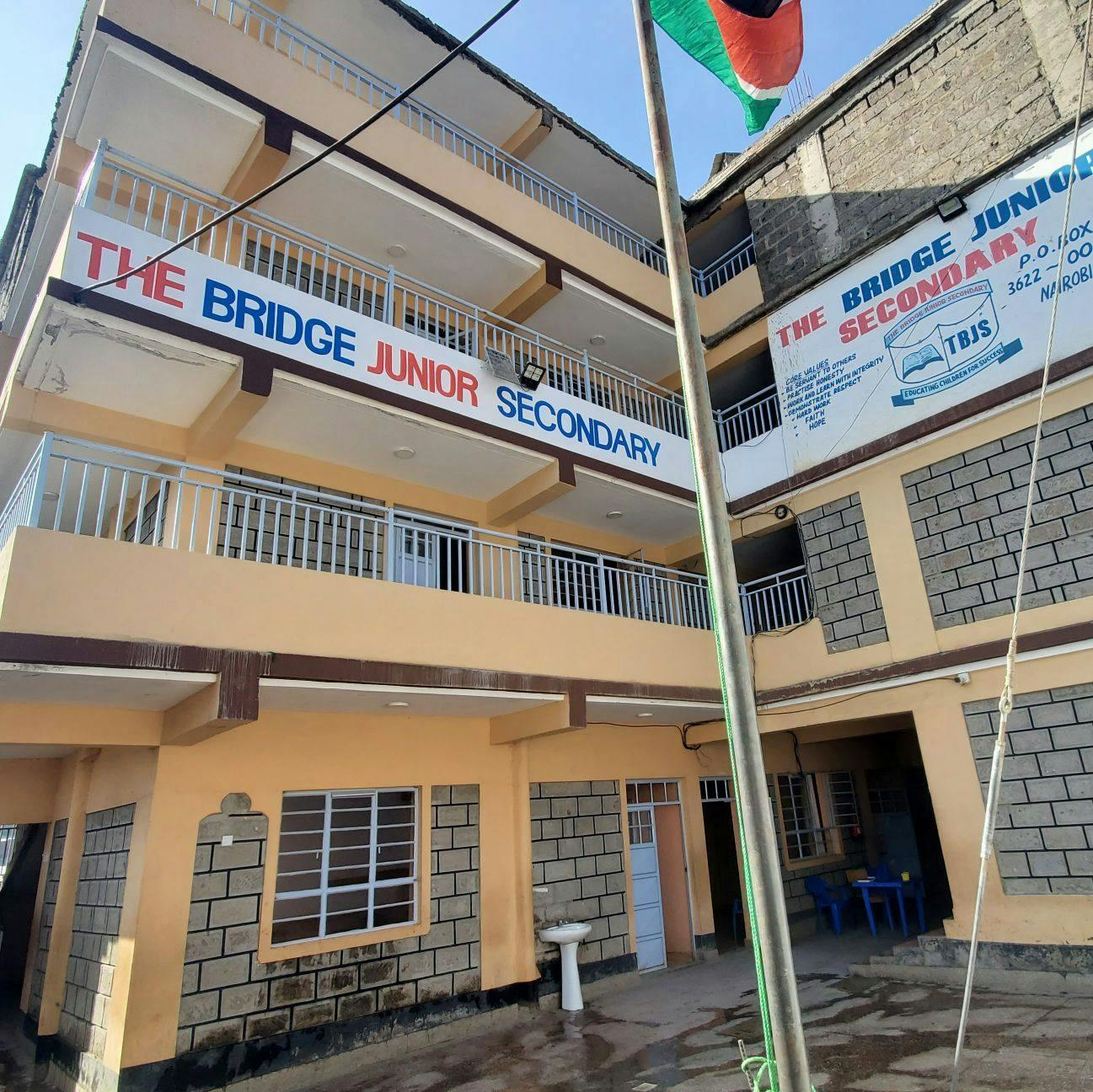 The Bridge Junior Secondary school building exterior with text on its facade