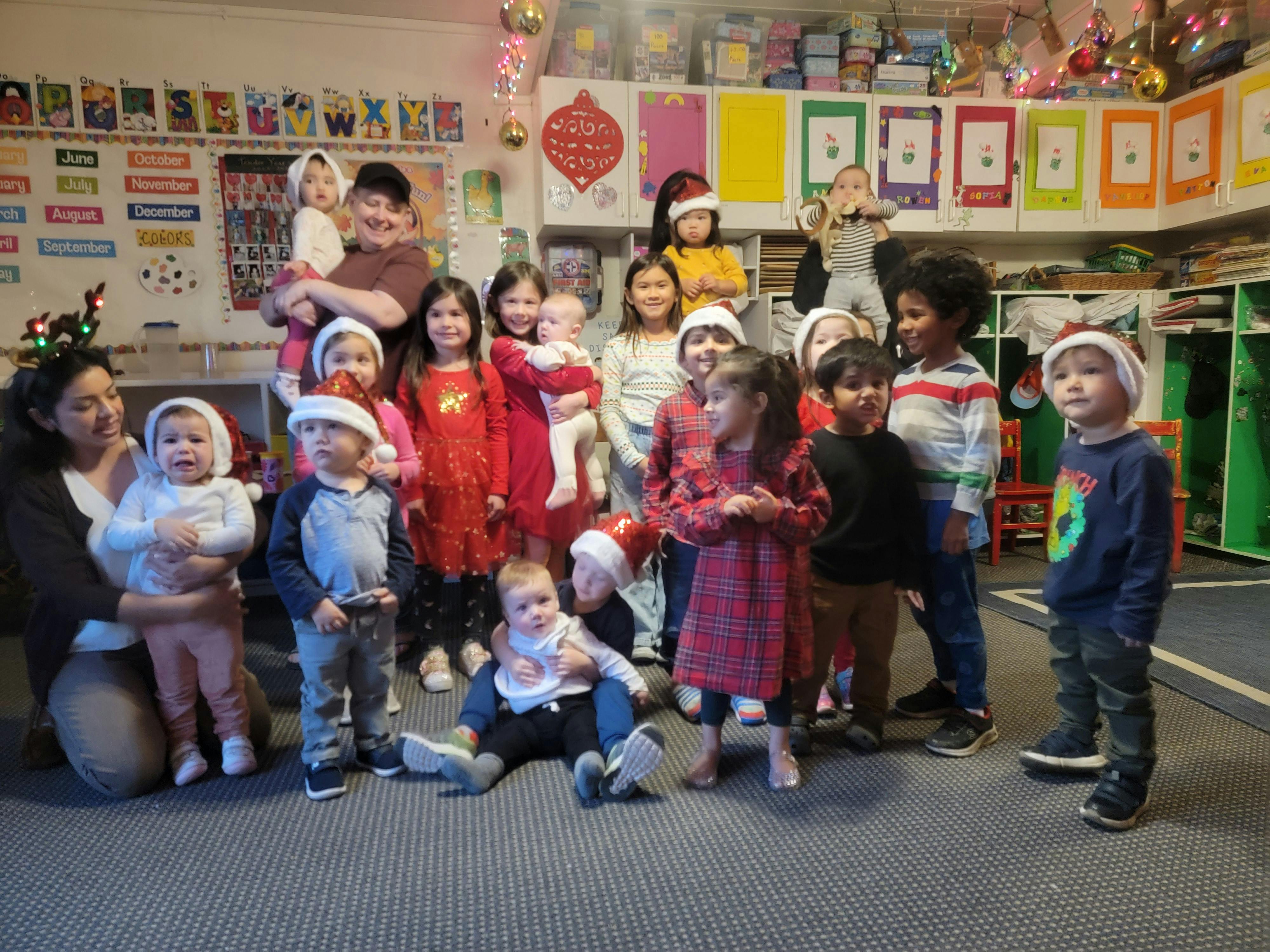Group of adults and children in a classroom