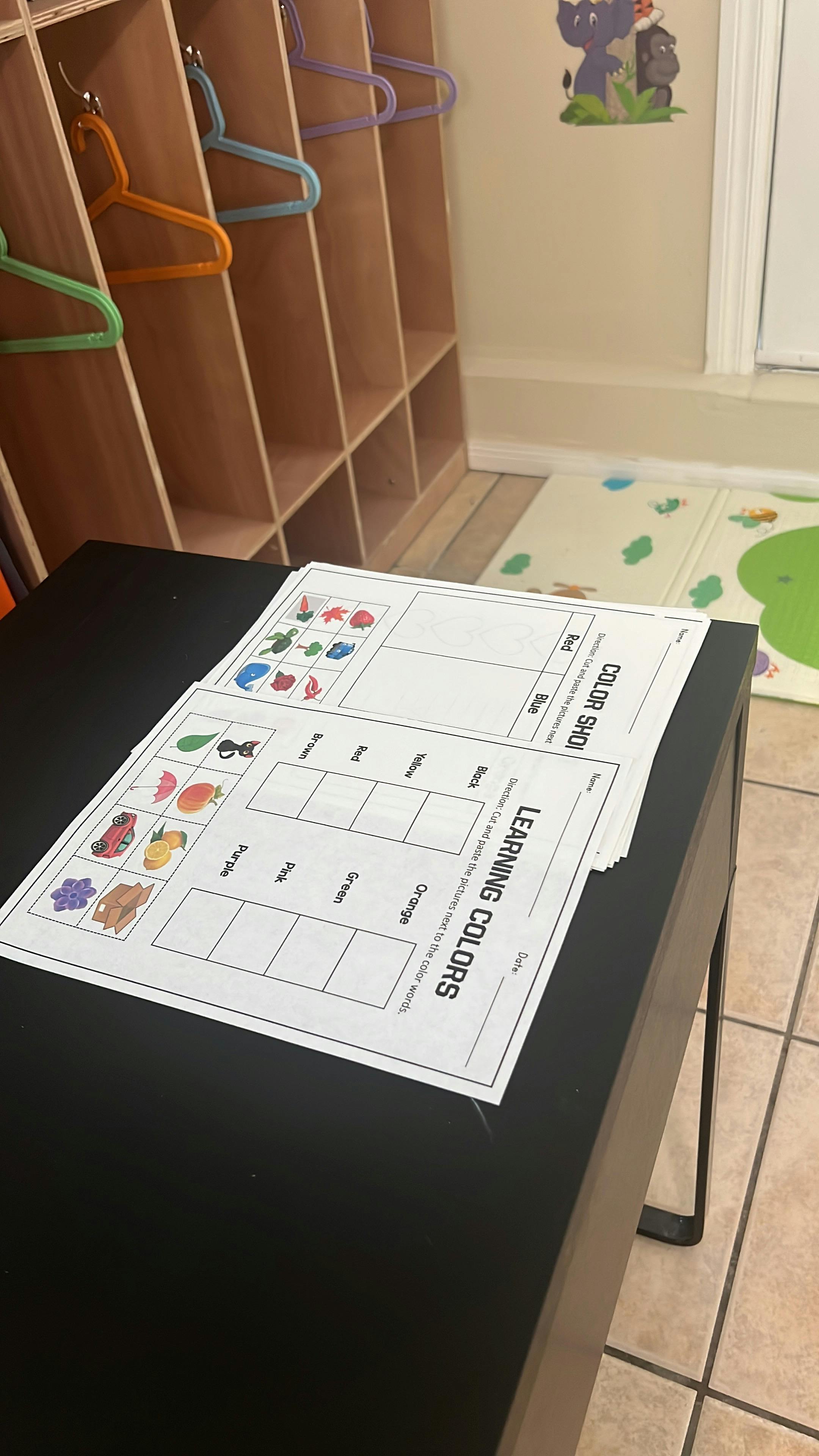 Learning colors worksheet on a black table in a classroom