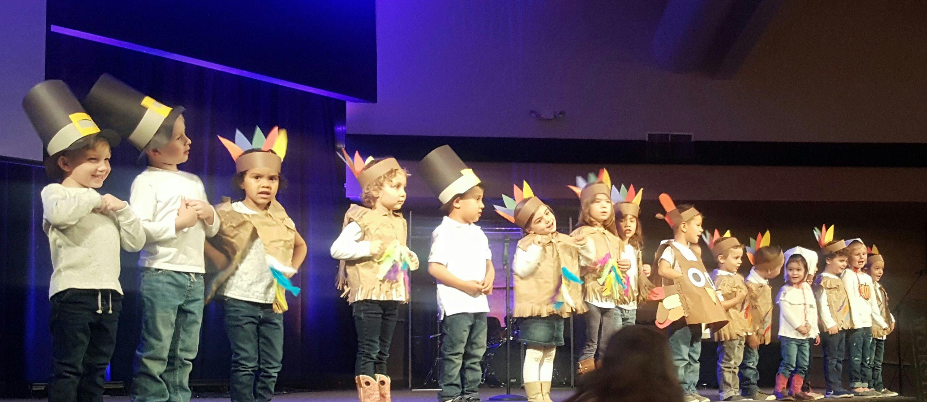 Children in costumes on a stage