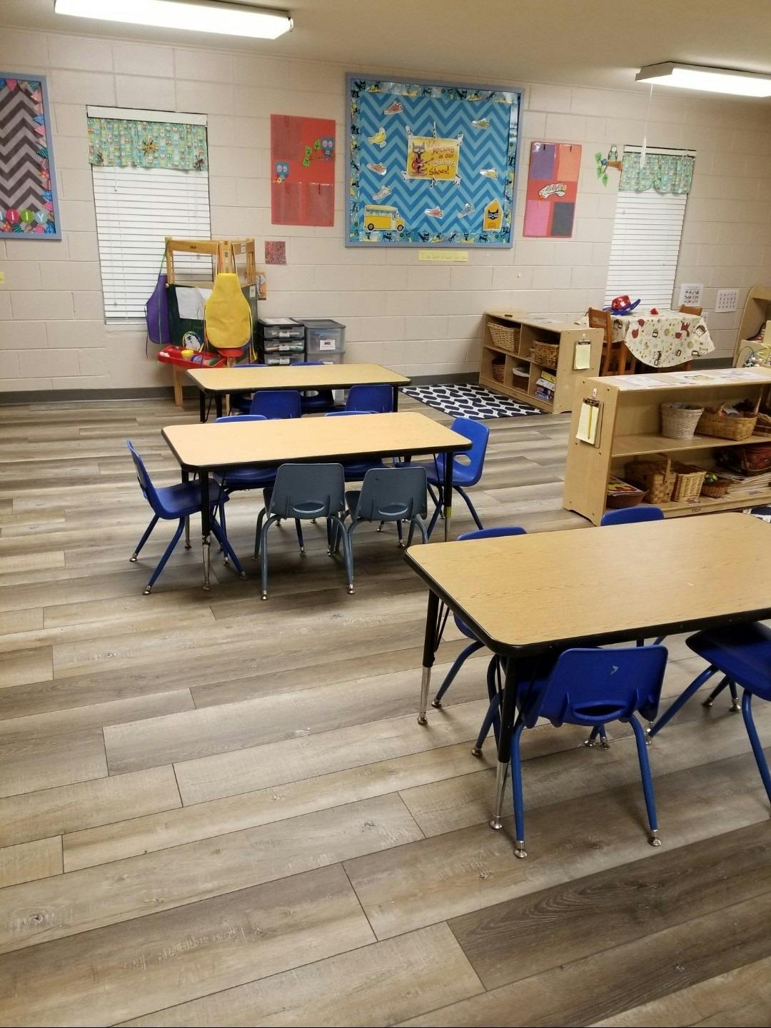 Classroom with several tables and chairs