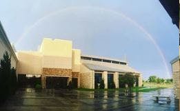 Building with a rainbow over it
