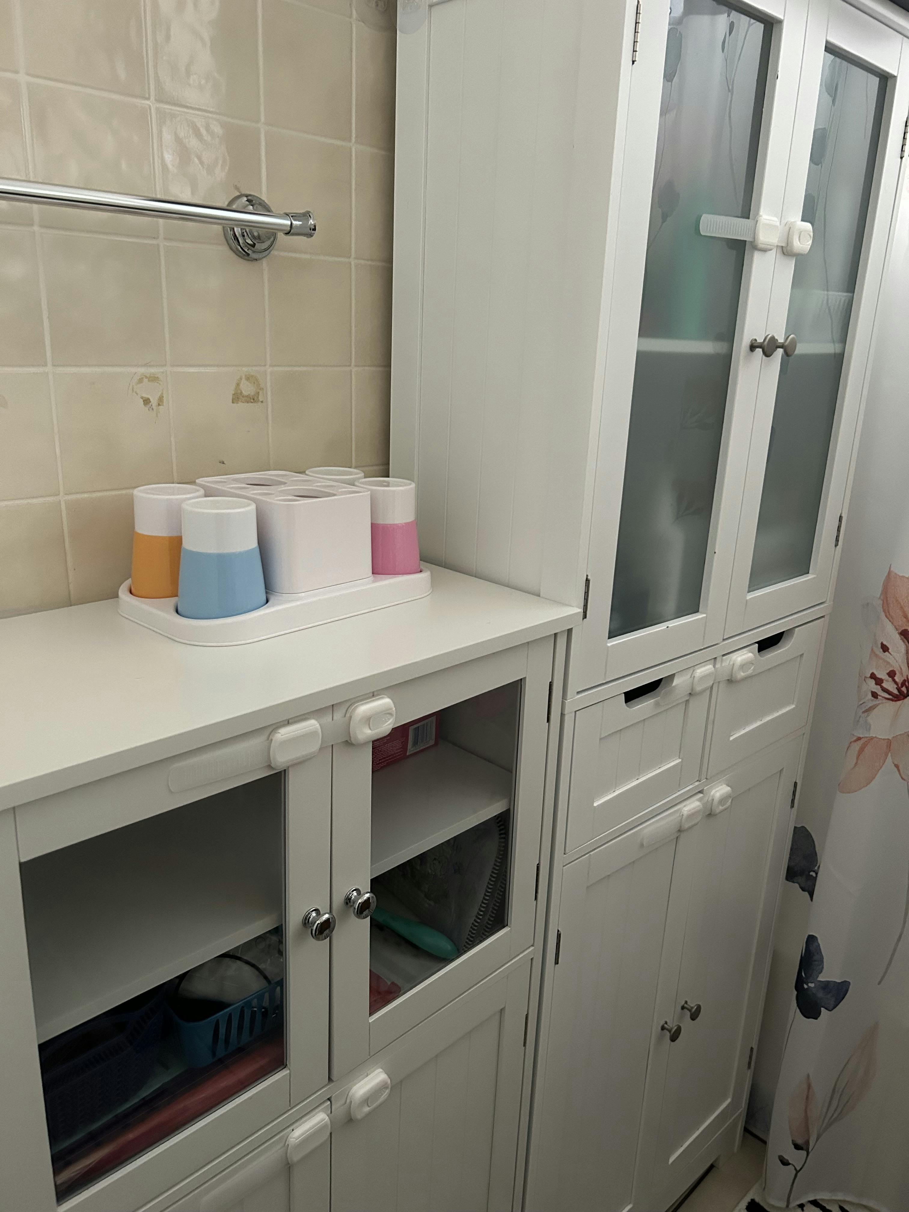 Bathroom storage cabinets with cups on top