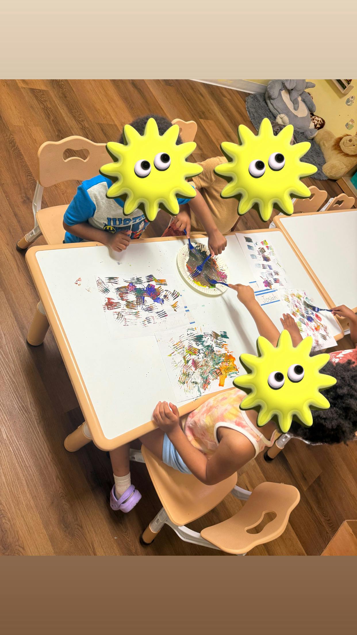 Children painting at a table