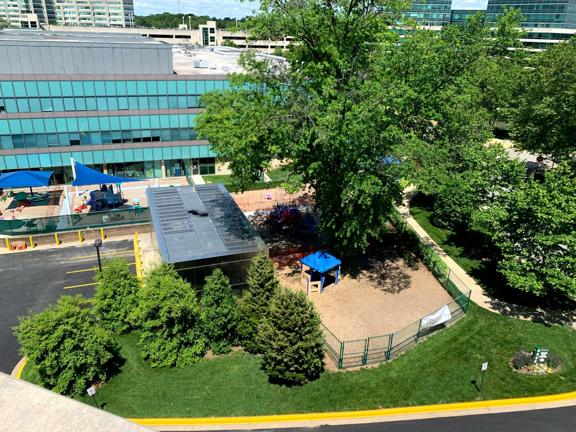 Aerial view of a playground with shade structures and play equipment