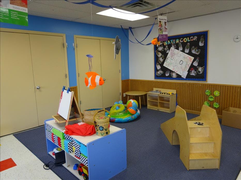 Childcare playroom with educational toys and colorful decorations