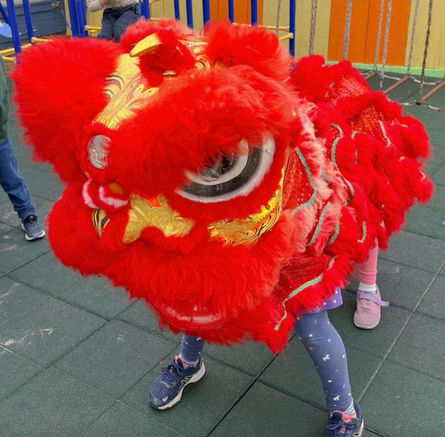 Children performing a lion dance