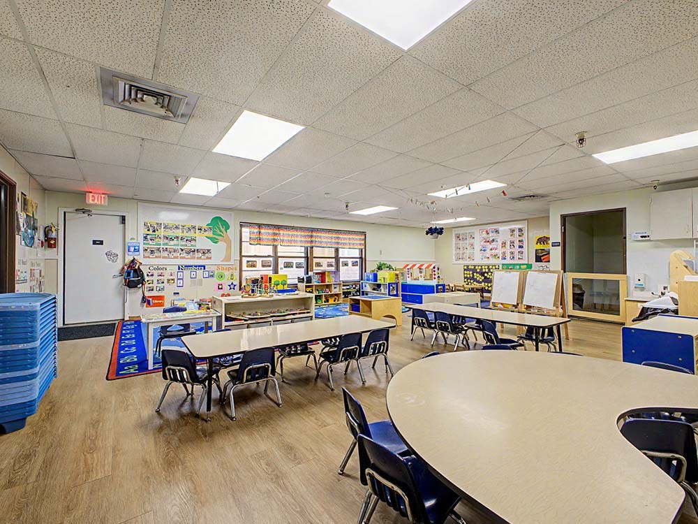 Empty classroom with tables and chairs