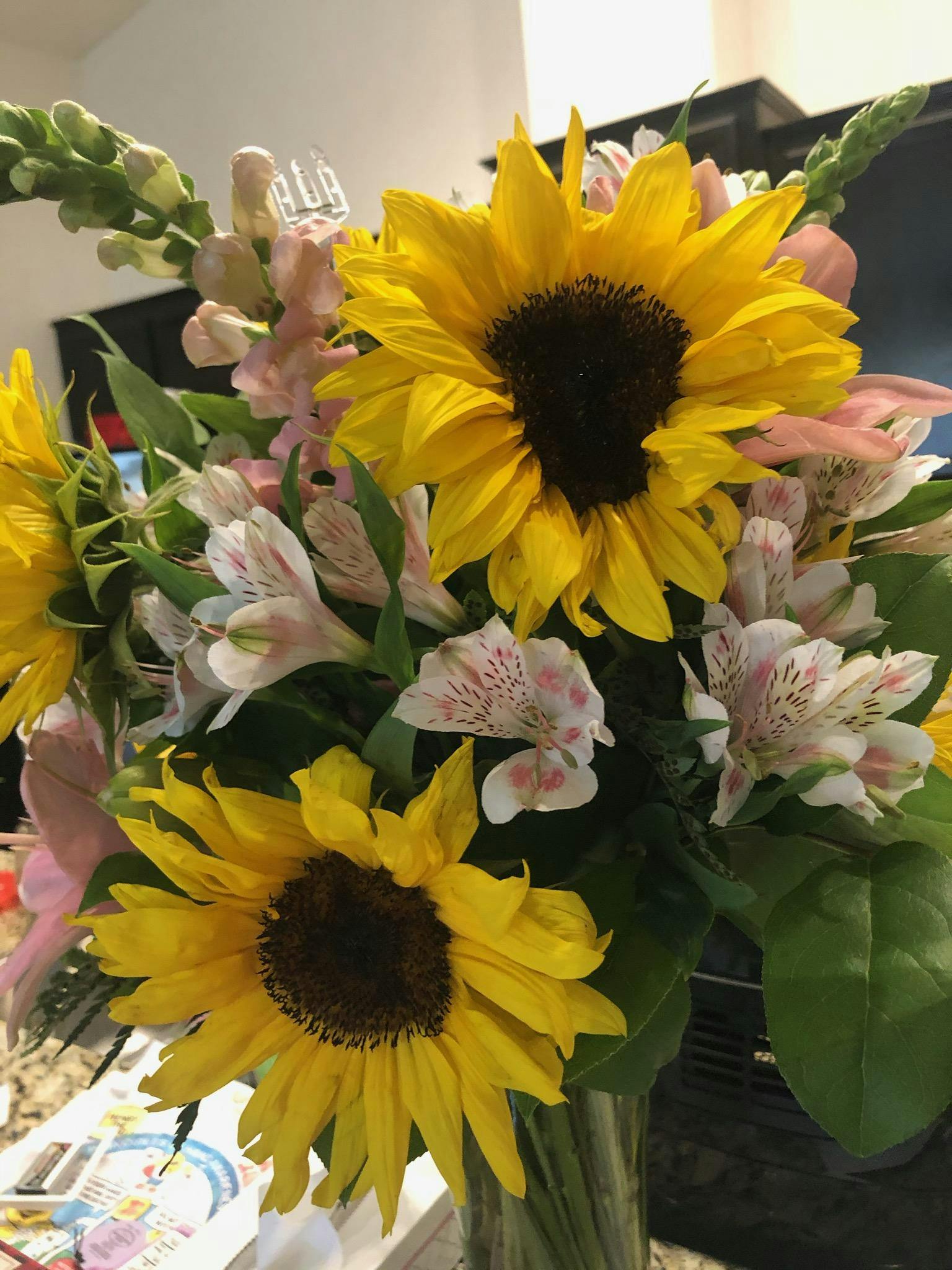 Bouquet of sunflowers, pink snapdragons, and white alstroemeria