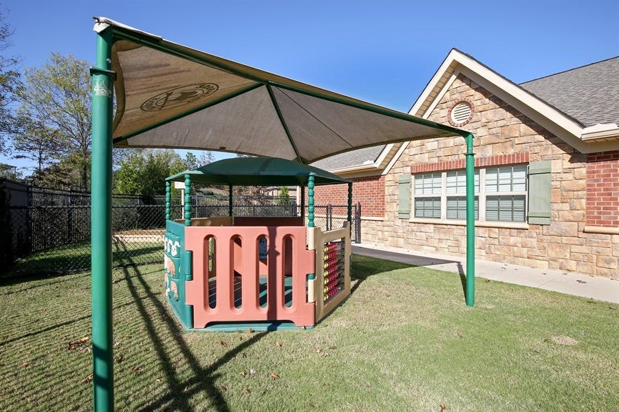 Outdoor play structure with a shade canopy