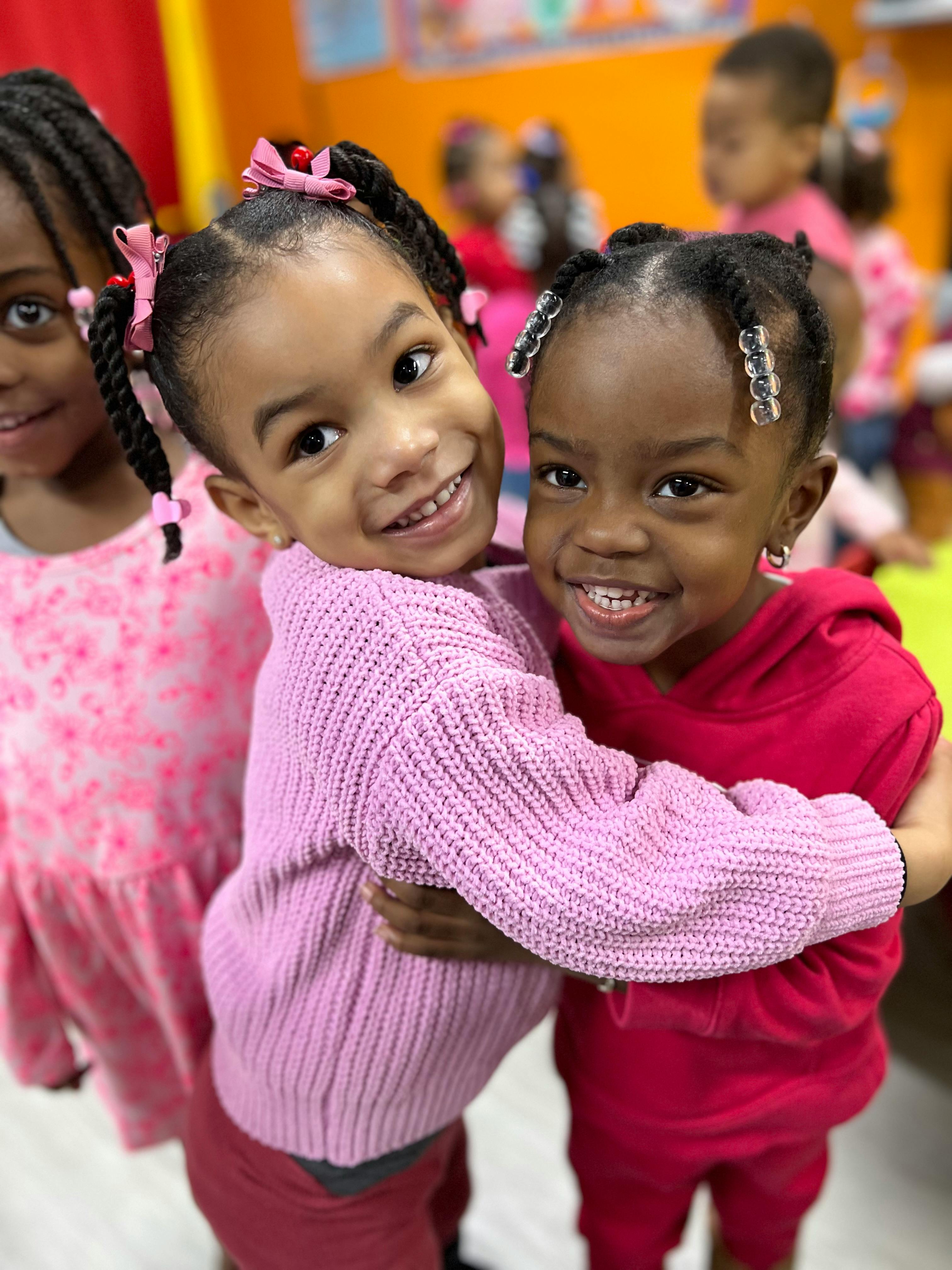 Two children hugging and smiling