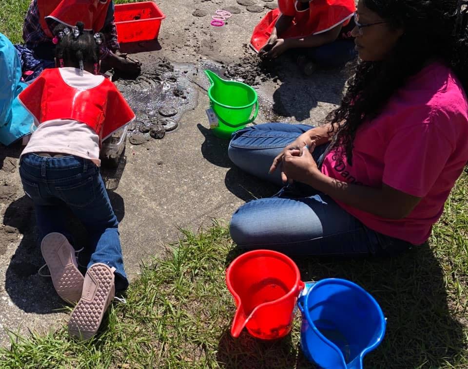 People playing with buckets outdoors