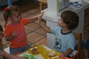 Two children playing at a table