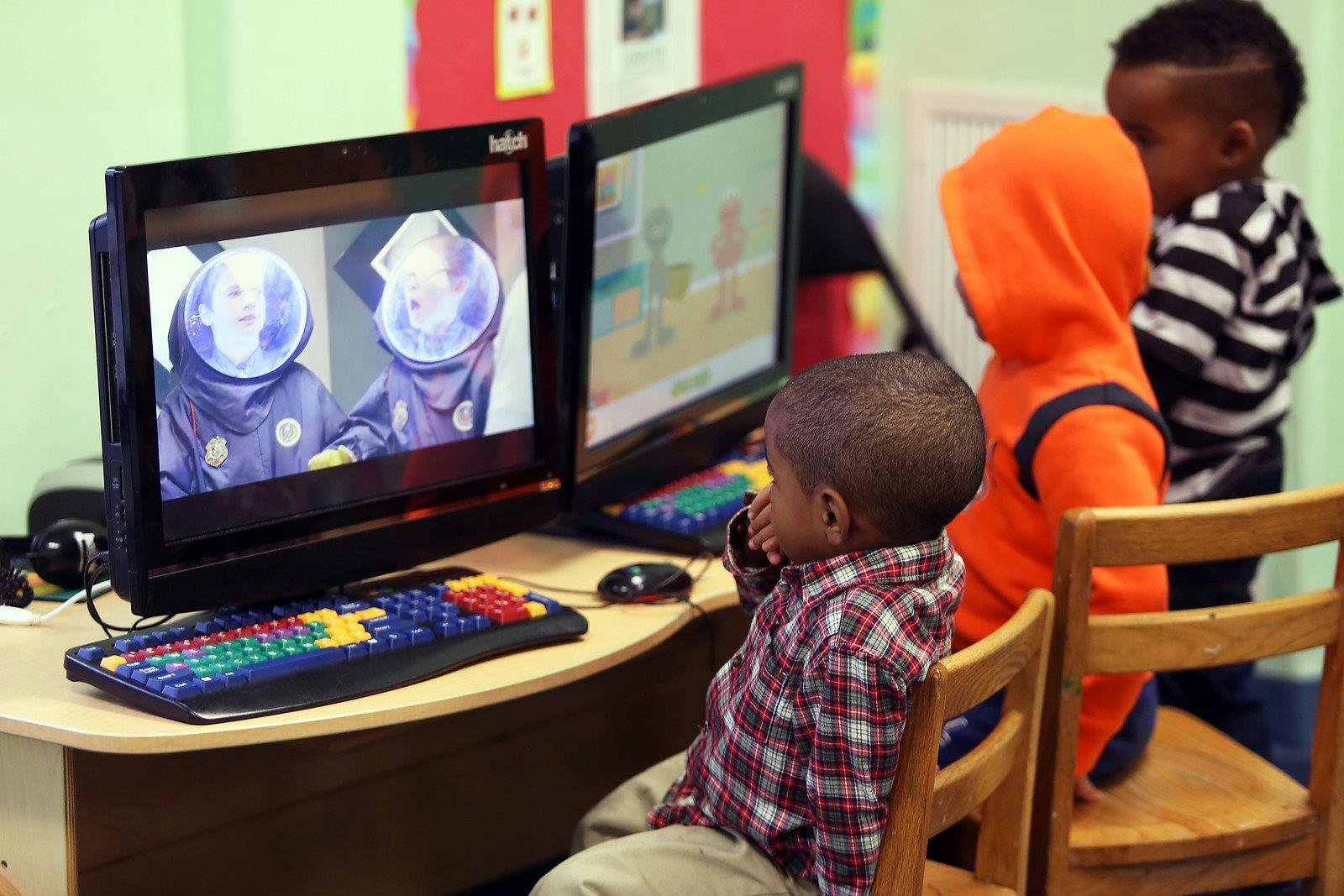 Children looking at computer screens in a classroom