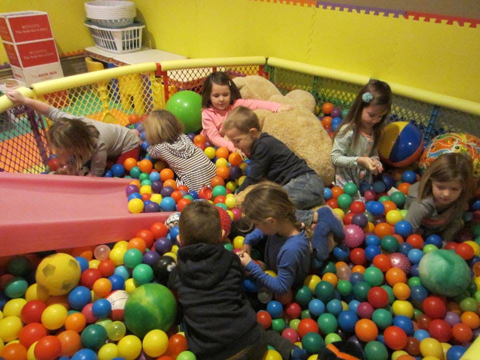 Children playing in a ball pit