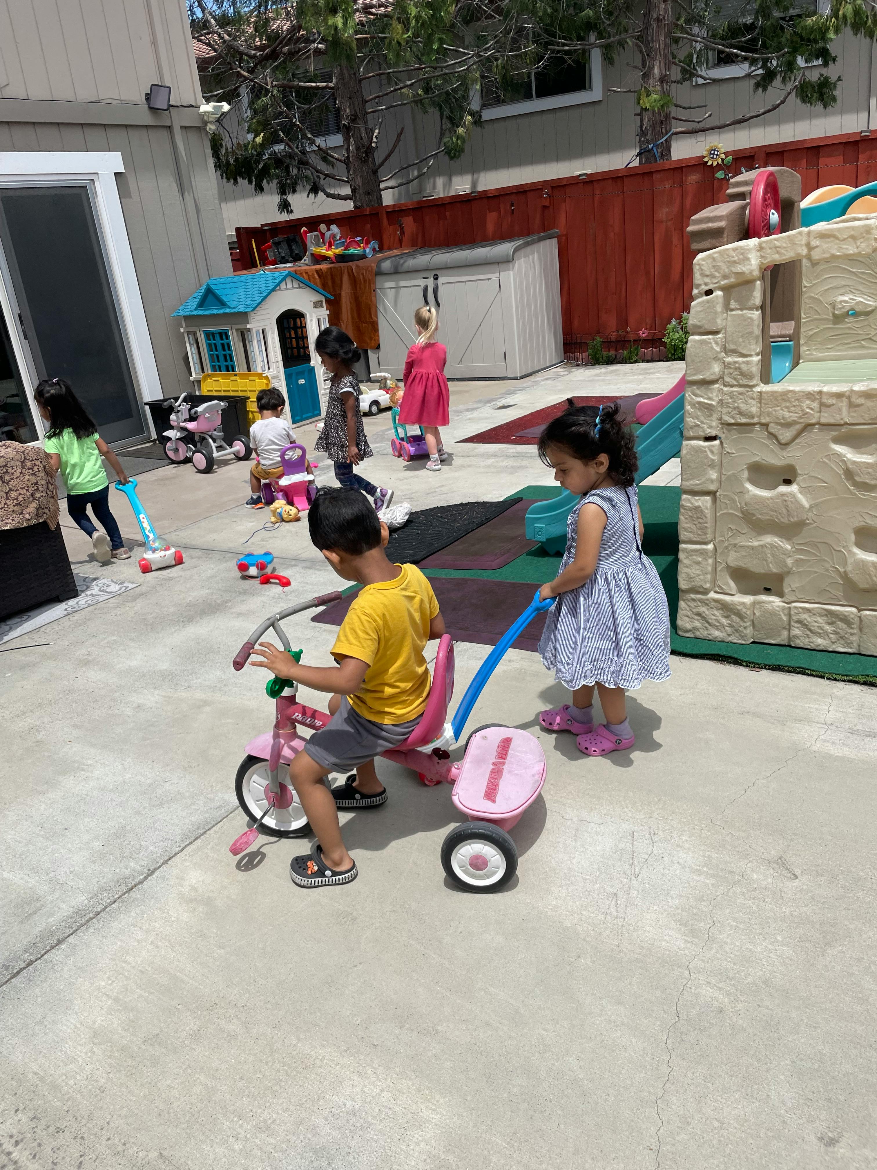 Children playing with toys outdoors